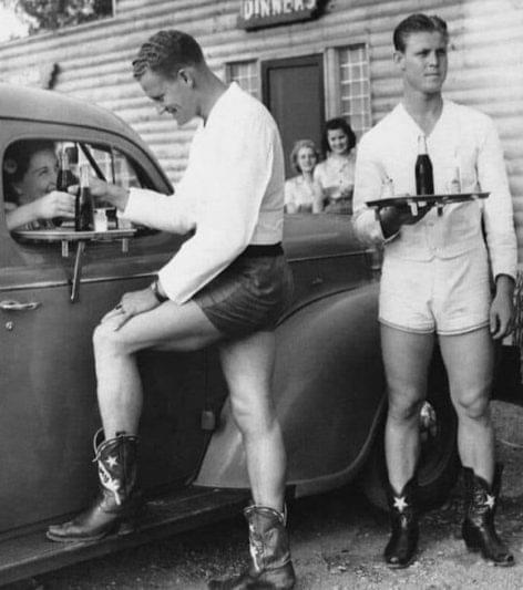 Scantily dressed waiters at the drive-thru bar – Picture of the day