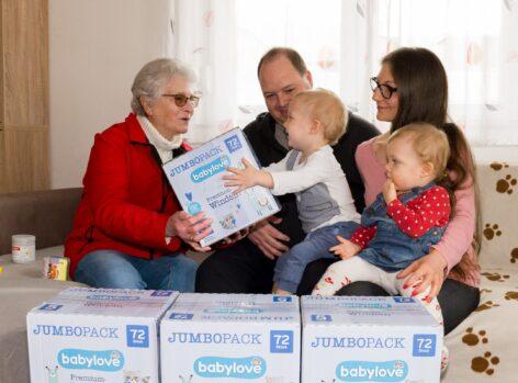 dm helps families with small children in need with 75 pallets of diapers